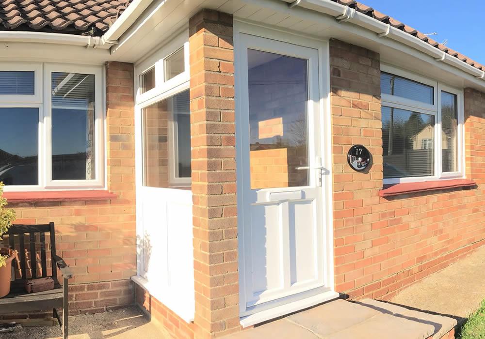 uPVC residential front door with decorative glass