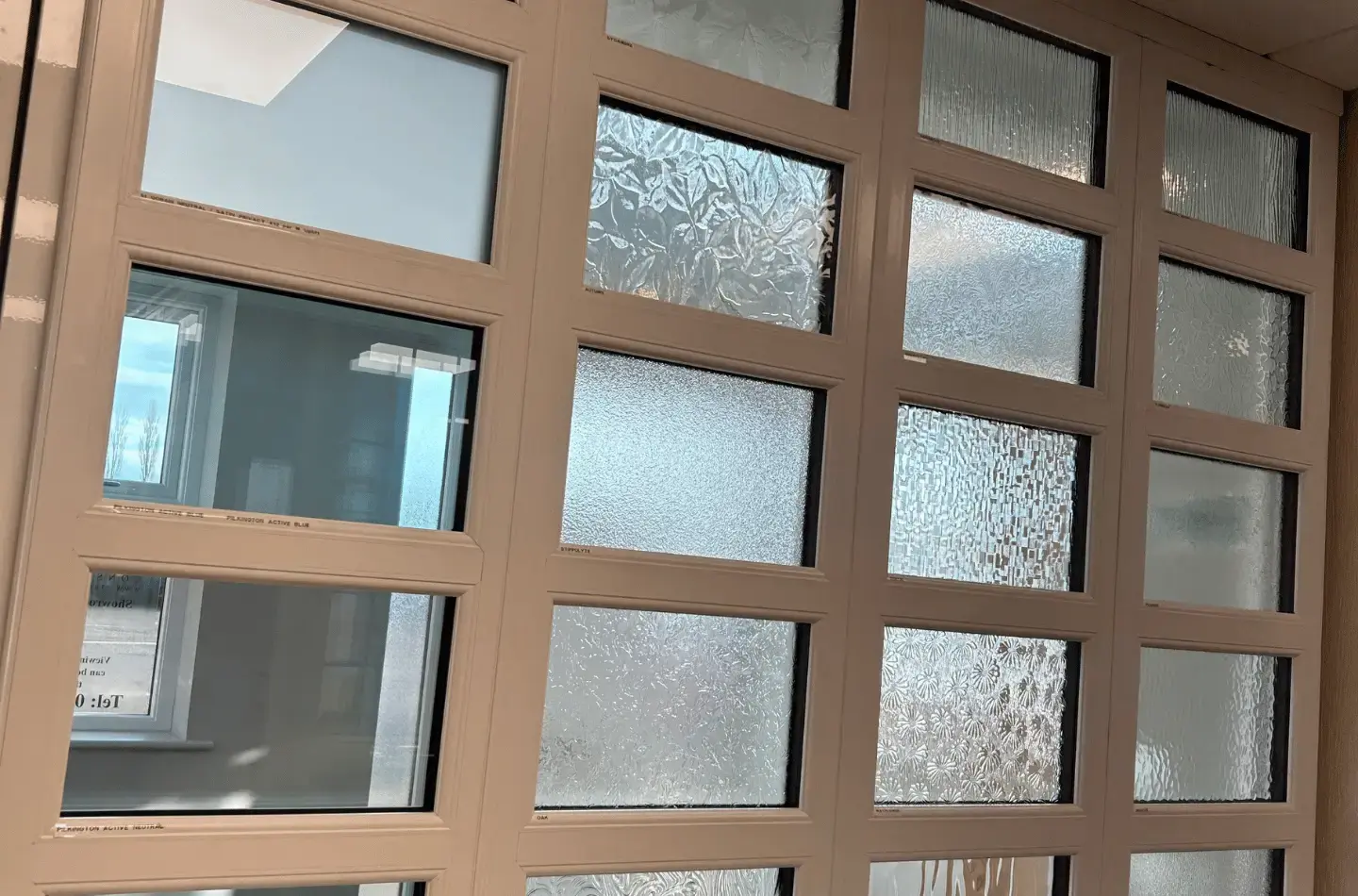 Close-up of obscure patterned glass panes in a window display