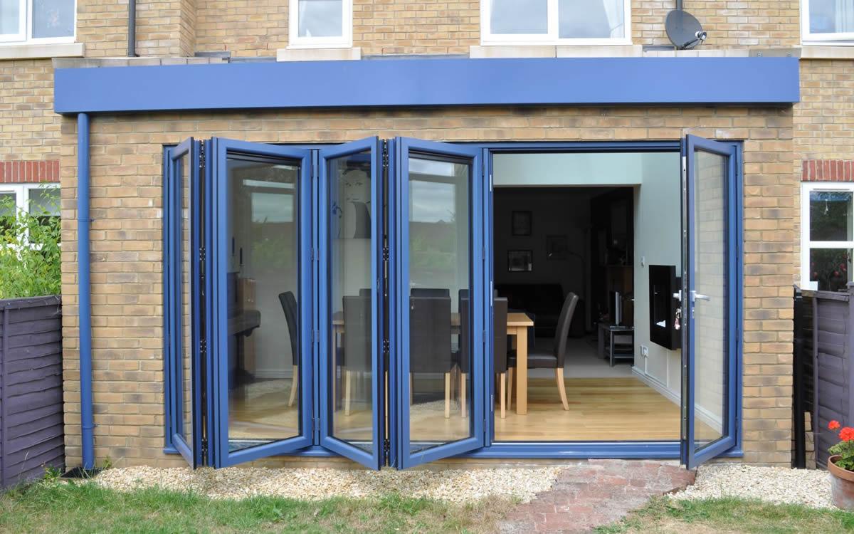 Origin bifolding doors opening from a modern kitchen