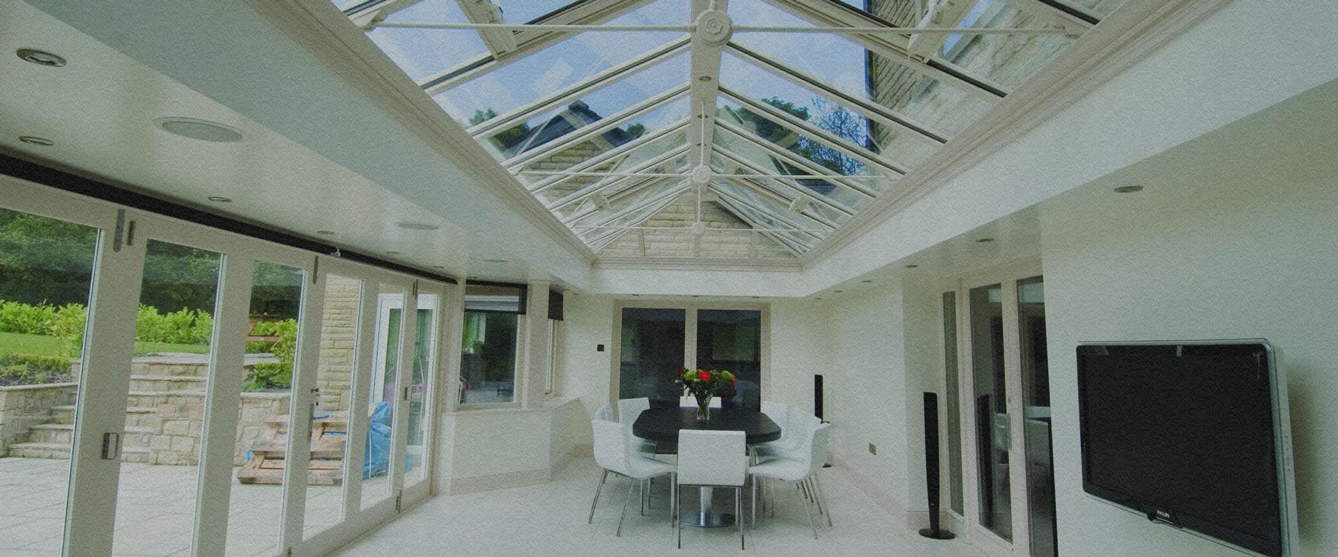 Orangery with brick piers and a glazed lantern roof