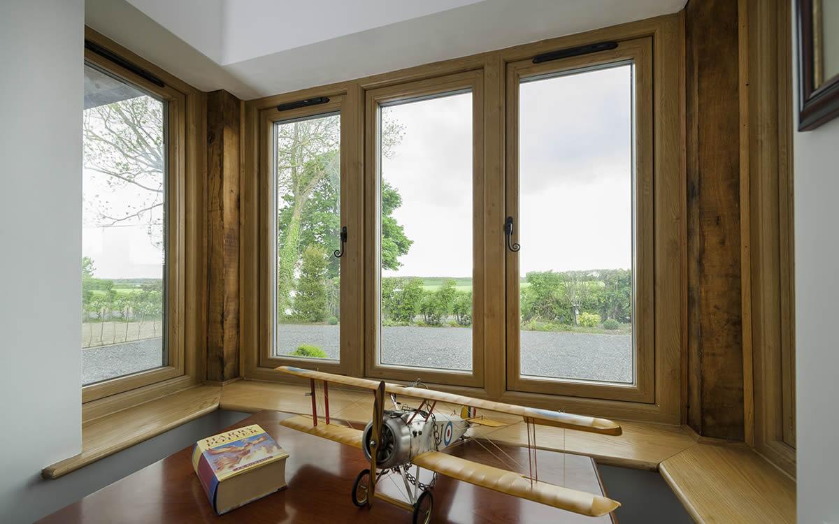Residence 9 timber alternative windows in a room with wood panelling