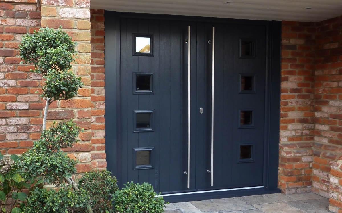 Composite front door with decorative glazing