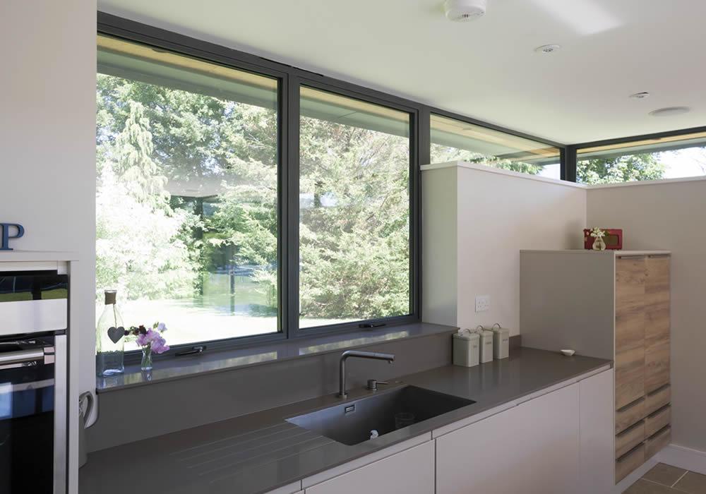 Aluminium windows above a kitchen worktop