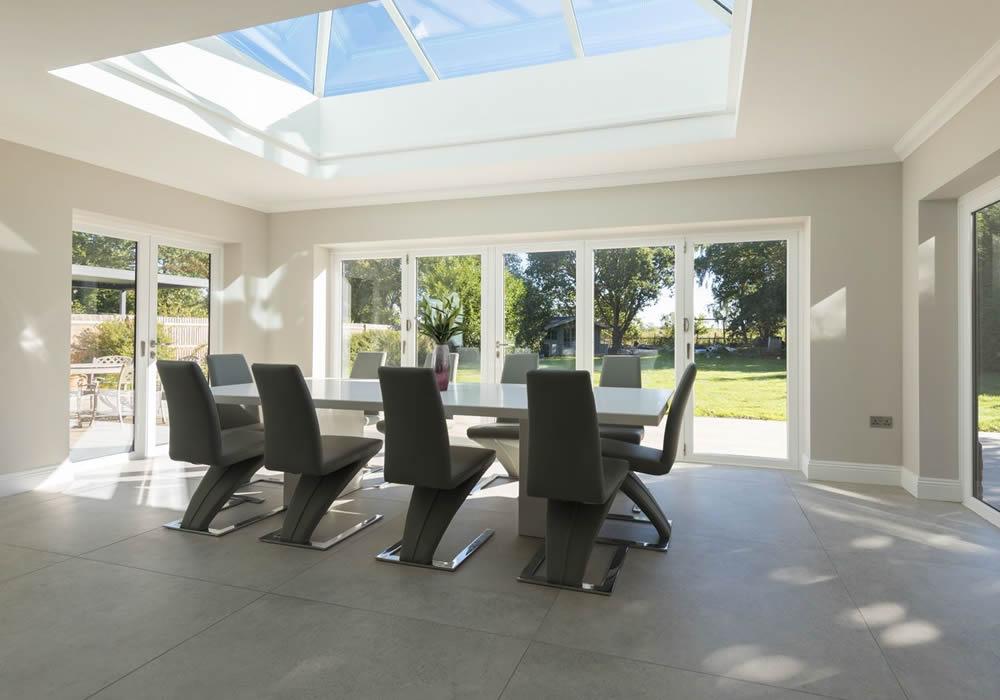 Origin aluminium bifolding doors opening onto a garden