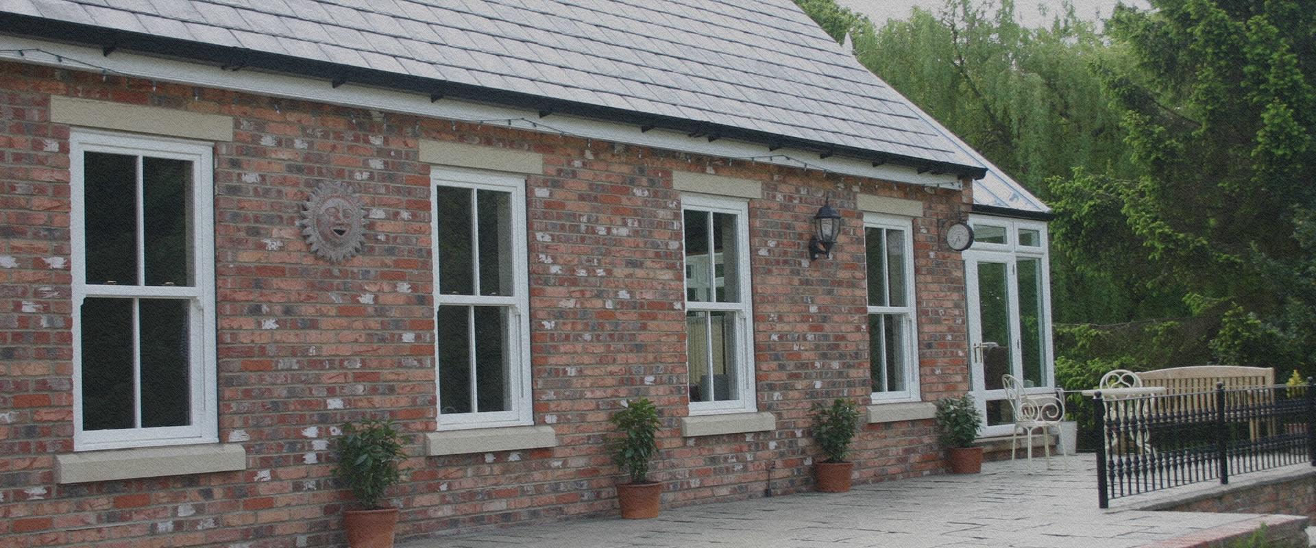 Vertical sliding sash windows on a period red brick property