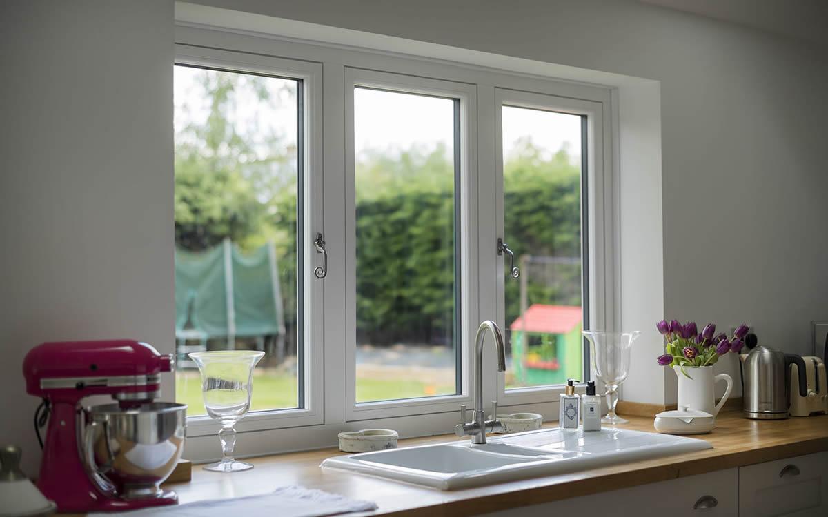 Residence 7 windows and french doors opening onto a kitchen