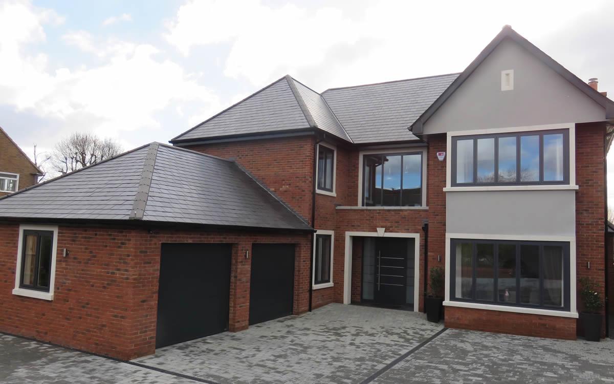 Smart aluminium windows on a red brick house