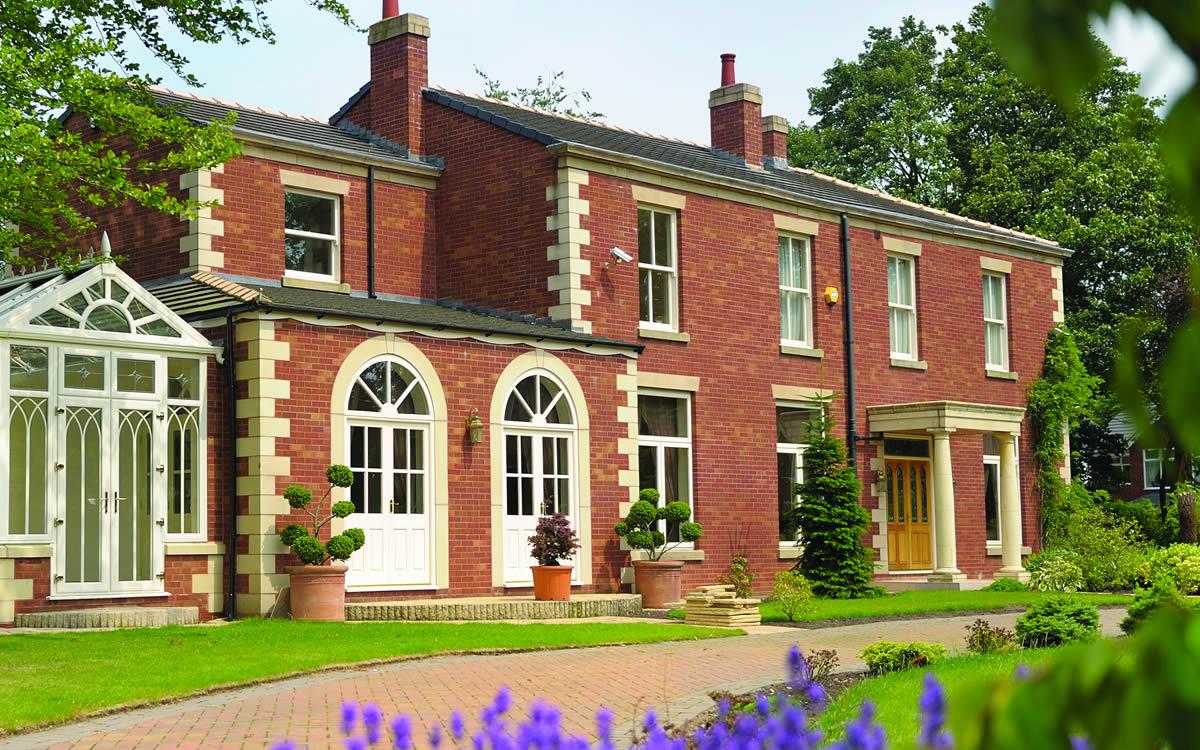 Vertical sliding sash windows on a period red brick property