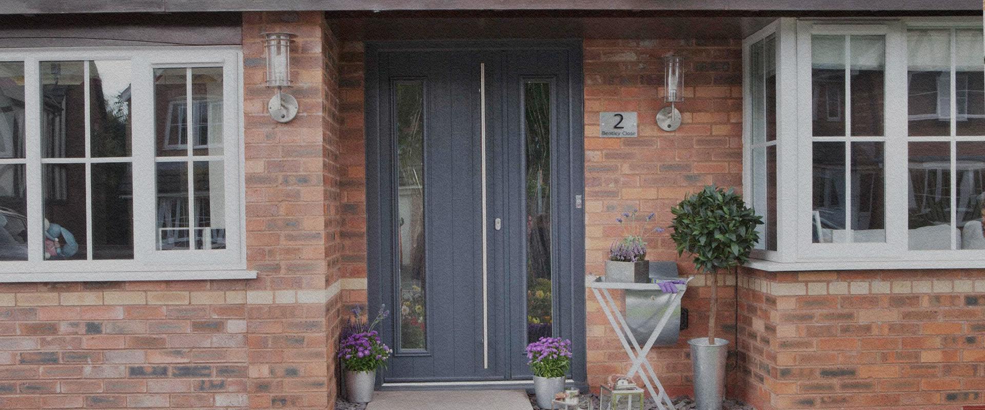 Composite front door with decorative glazing