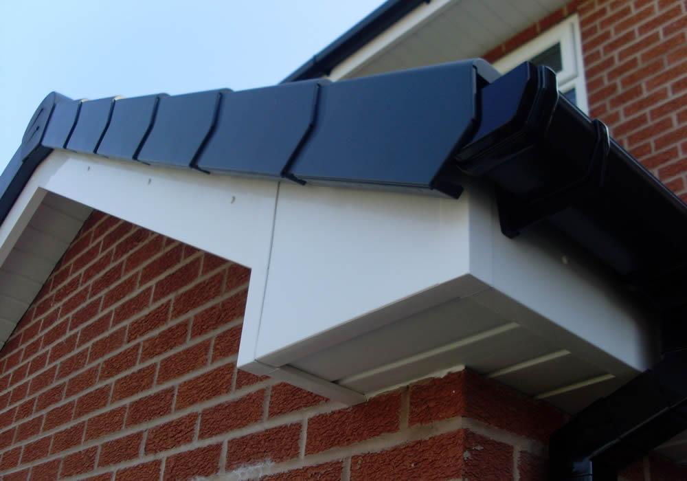 White PVCu fascia and soffit board along a roofline