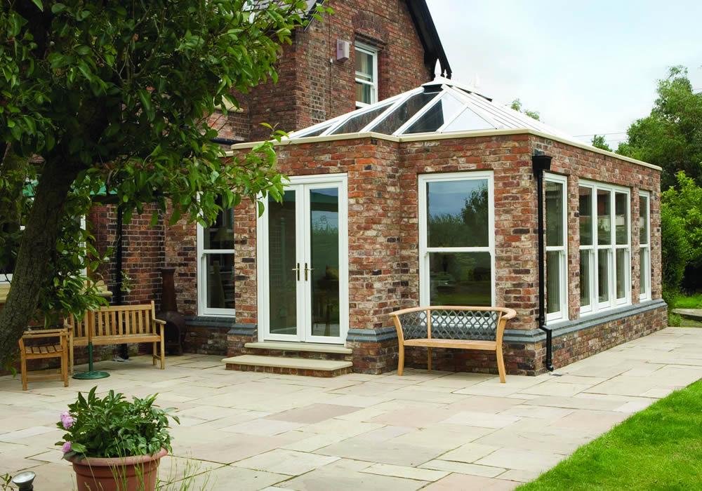 Orangery lit in the evening with roof spotlights